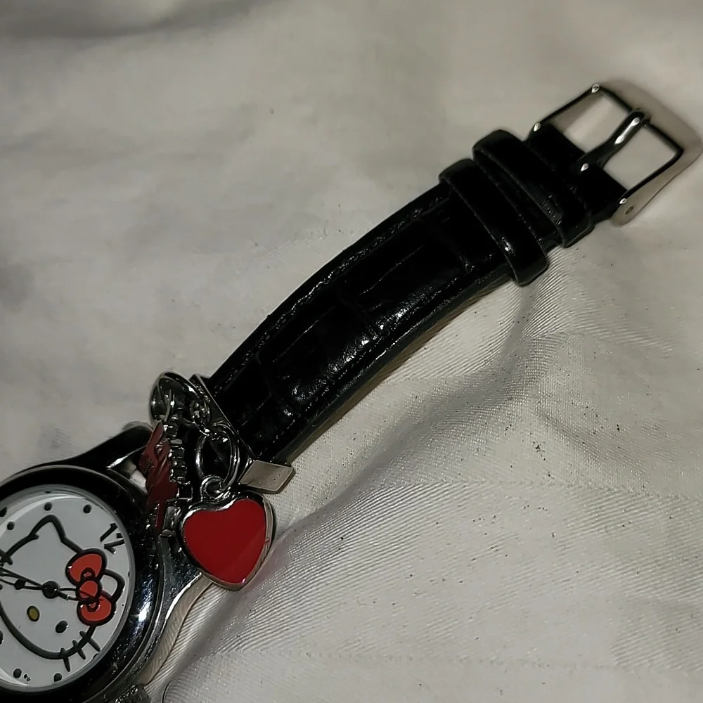 NWOT Sanrio Hello Kitty Womens Charm Quartz Watch Black Leather Band Silver Case